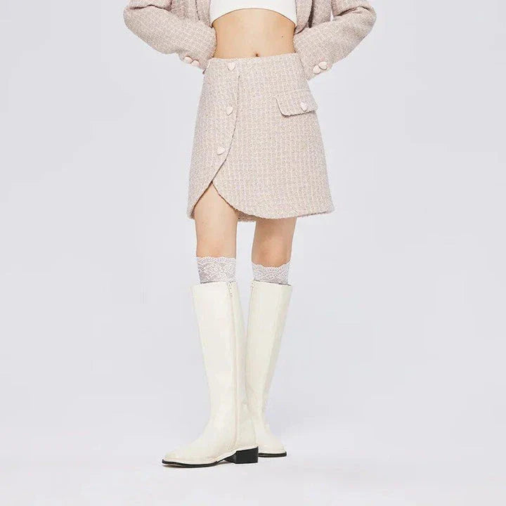 Chic asymmetric plaid a-line skirt in pink, featuring a unique design with button details and a flattering silhouette