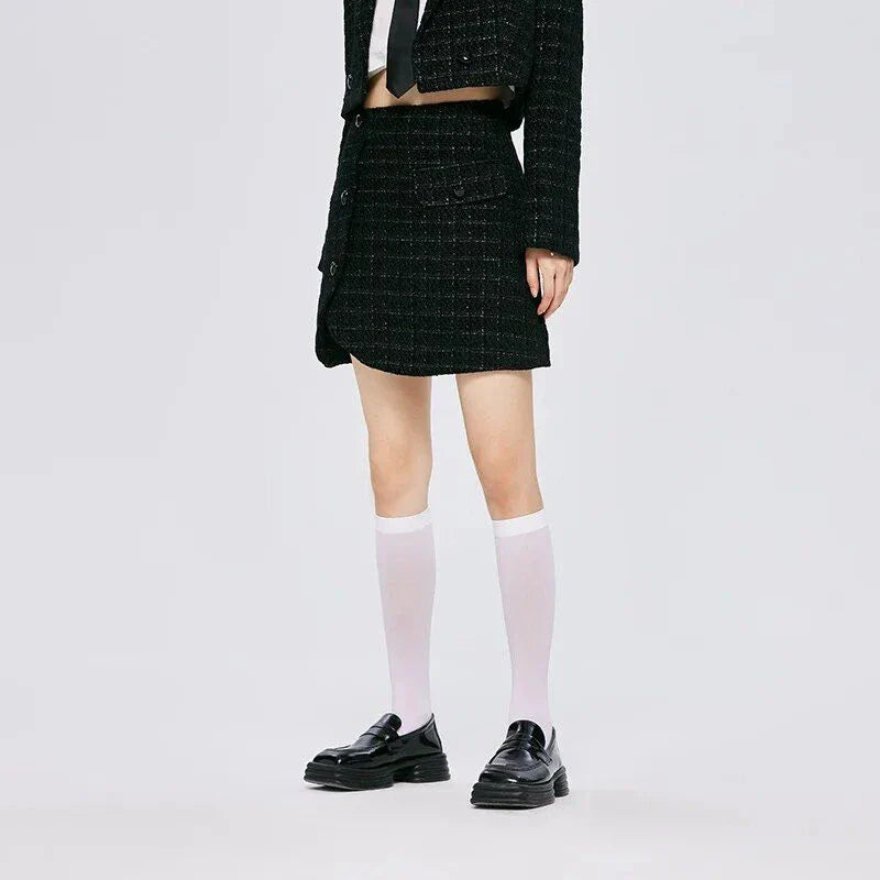 Chic asymmetric plaid a-line skirt in pink, featuring a unique design with button details and a flattering silhouette