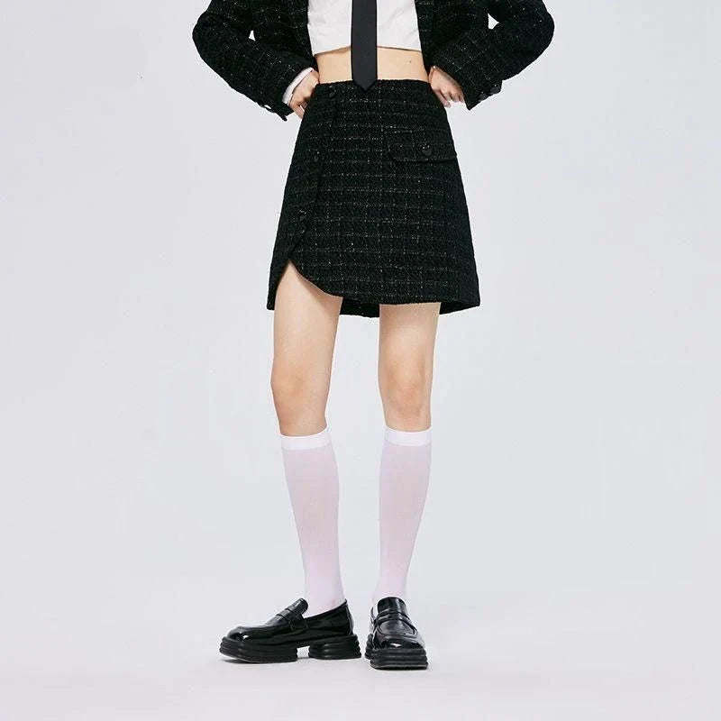 Chic asymmetric plaid a-line skirt in pink, featuring a unique design with button details and a flattering silhouette