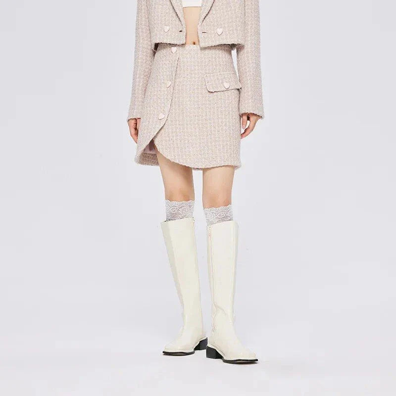 Chic asymmetric plaid a-line skirt in pink, featuring a unique design with button details and a flattering silhouette
