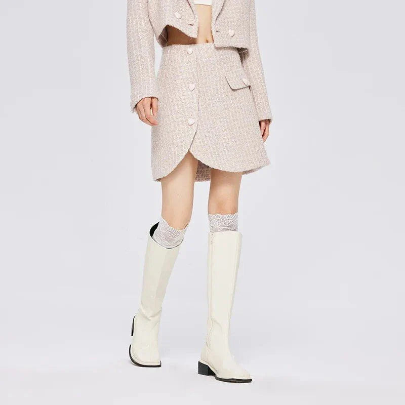 Chic asymmetric plaid a-line skirt in pink, featuring a unique design with button details and a flattering silhouette