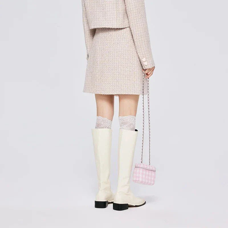 Chic asymmetric plaid a-line skirt in pink, featuring a unique design with button details and a flattering silhouette