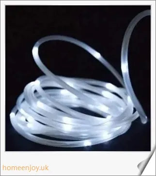 40ft solar-powered garden pathway light strips in use, illuminating a winding garden path with a warm, enchanting glow