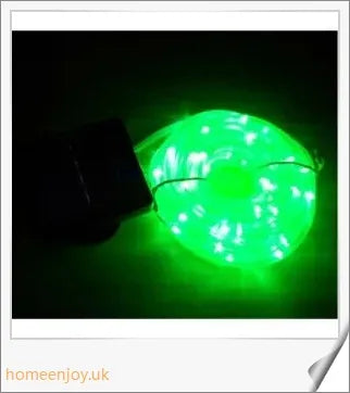 40ft solar-powered garden pathway light strips in use, illuminating a winding garden path with a warm, enchanting glow