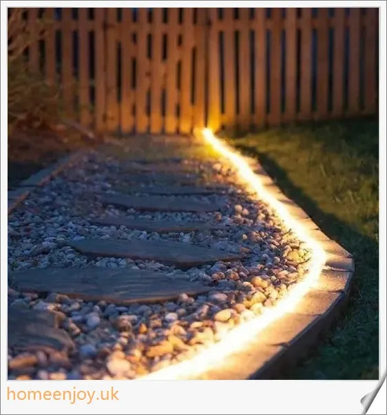 40ft solar-powered garden pathway light strips in use, illuminating a winding garden path with a warm, enchanting glow