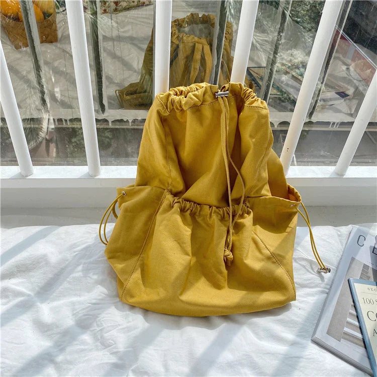 Creative drawstring bucket bag in white, black, brown, and zebra print patterns - a stylish and versatile women's tote bag made of high-quality polyester material
