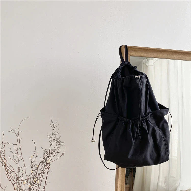 Creative drawstring bucket bag in white, black, brown, and zebra print patterns - a stylish and versatile women's tote bag made of high-quality polyester material