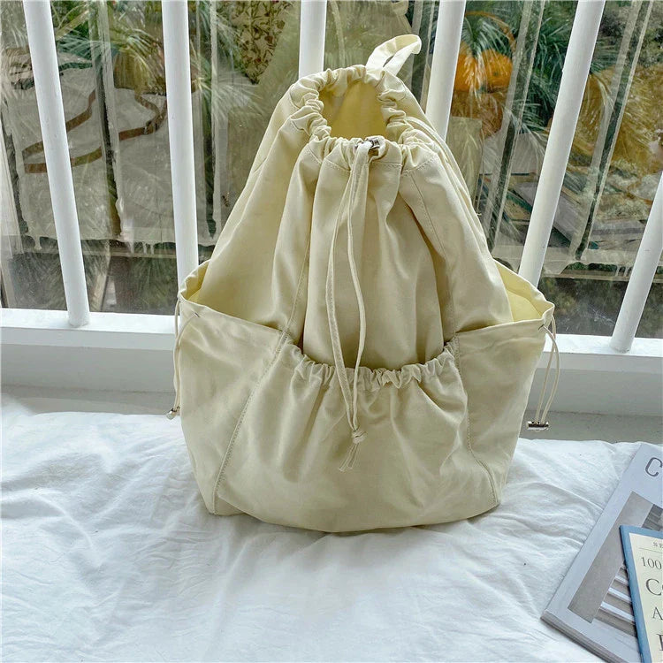 Creative drawstring bucket bag in white, black, brown, and zebra print patterns - a stylish and versatile women's tote bag made of high-quality polyester material