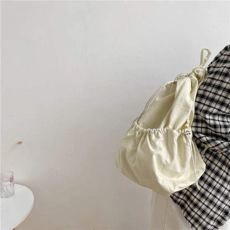 Creative drawstring bucket bag in white, black, brown, and zebra print patterns - a stylish and versatile women's tote bag made of high-quality polyester material