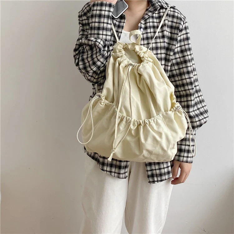 Creative drawstring bucket bag in white, black, brown, and zebra print patterns - a stylish and versatile women's tote bag made of high-quality polyester material