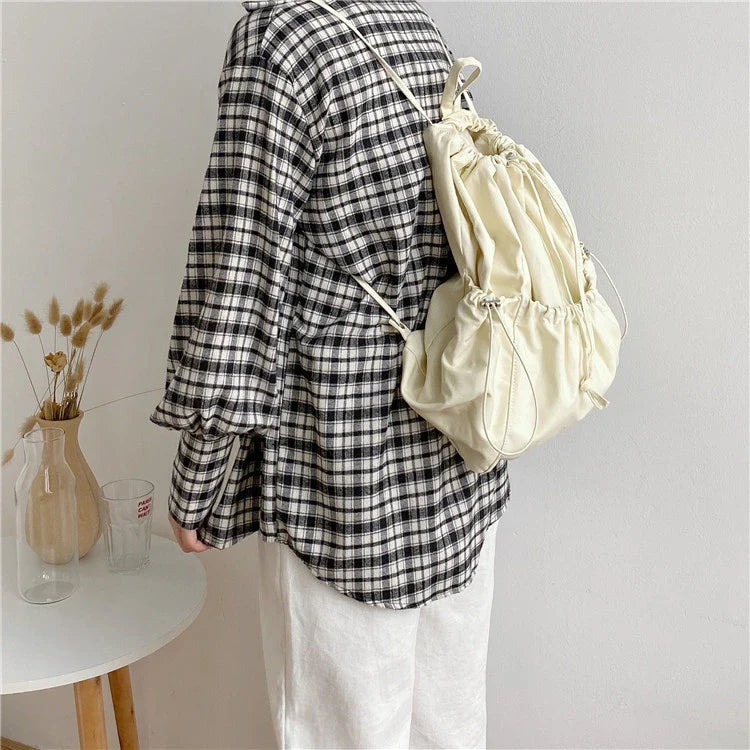 Creative drawstring bucket bag in white, black, brown, and zebra print patterns - a stylish and versatile women's tote bag made of high-quality polyester material