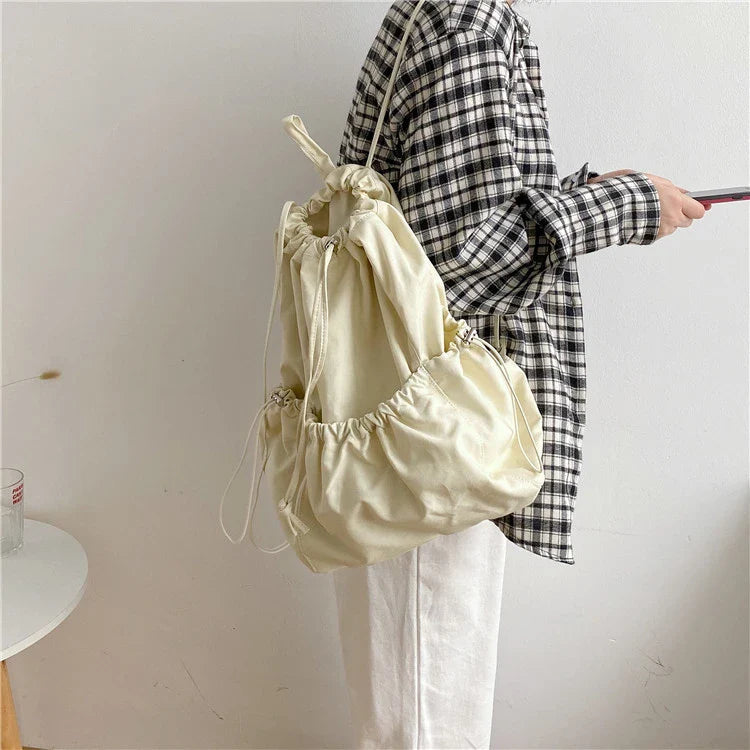 Creative drawstring bucket bag in white, black, brown, and zebra print patterns - a stylish and versatile women's tote bag made of high-quality polyester material