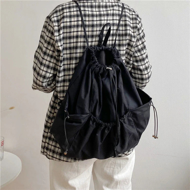 Creative drawstring bucket bag in white, black, brown, and zebra print patterns - a stylish and versatile women's tote bag made of high-quality polyester material