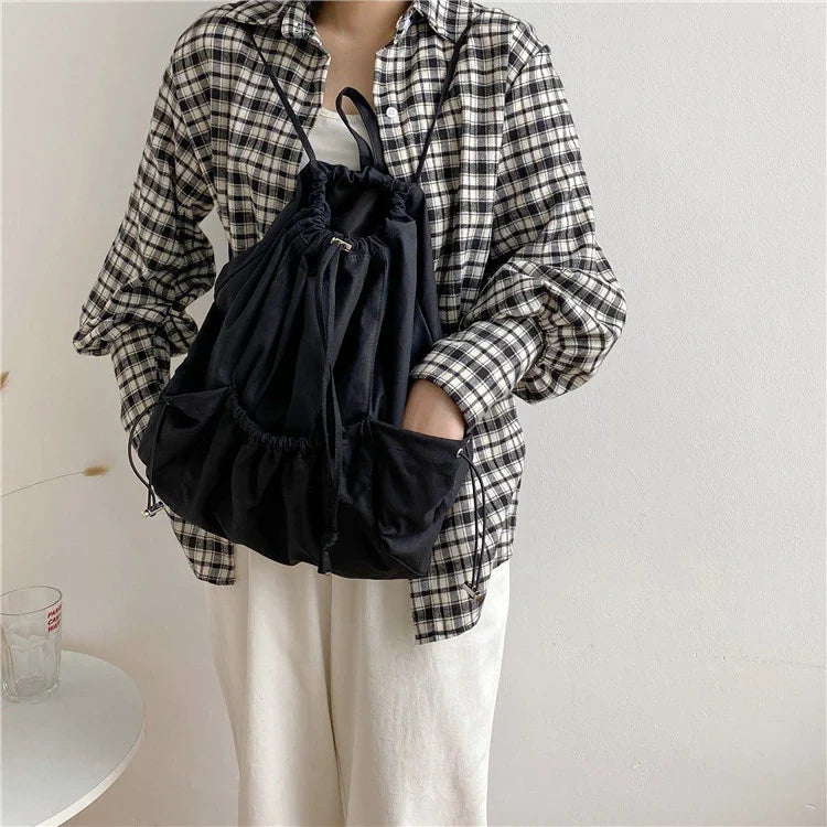 Creative drawstring bucket bag in white, black, brown, and zebra print patterns - a stylish and versatile women's tote bag made of high-quality polyester material