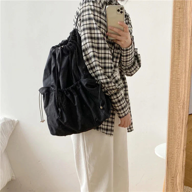 Creative drawstring bucket bag in white, black, brown, and zebra print patterns - a stylish and versatile women's tote bag made of high-quality polyester material