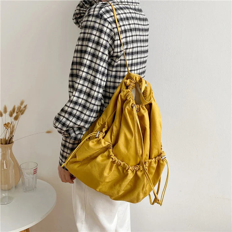 Creative drawstring bucket bag in white, black, brown, and zebra print patterns - a stylish and versatile women's tote bag made of high-quality polyester material