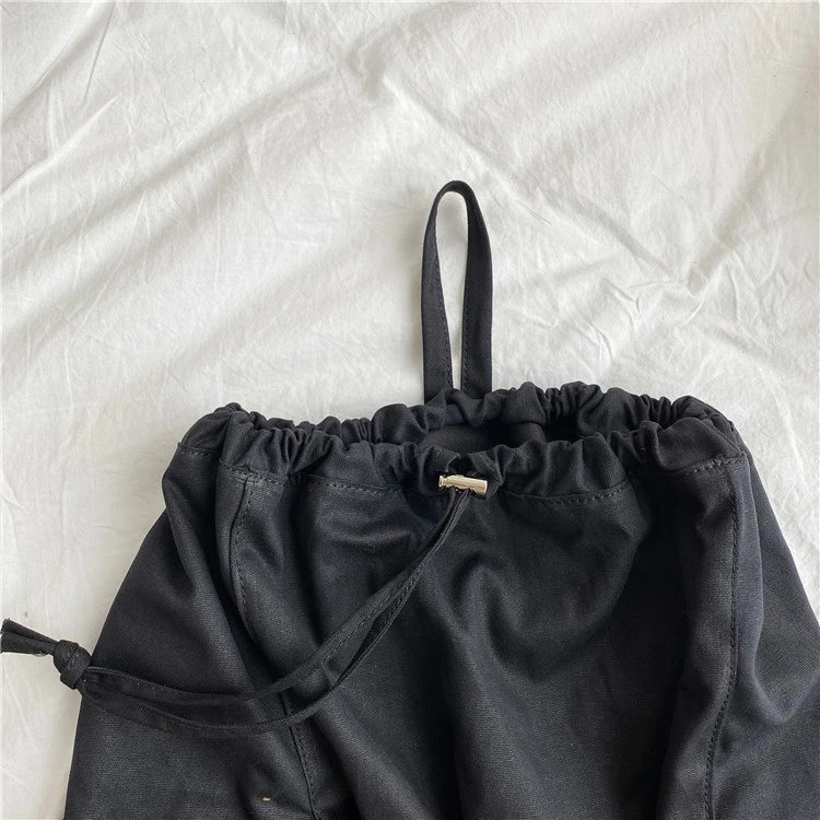 Creative drawstring bucket bag in white, black, brown, and zebra print patterns - a stylish and versatile women's tote bag made of high-quality polyester material