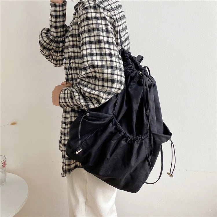 Creative drawstring bucket bag in white, black, brown, and zebra print patterns - a stylish and versatile women's tote bag made of high-quality polyester material