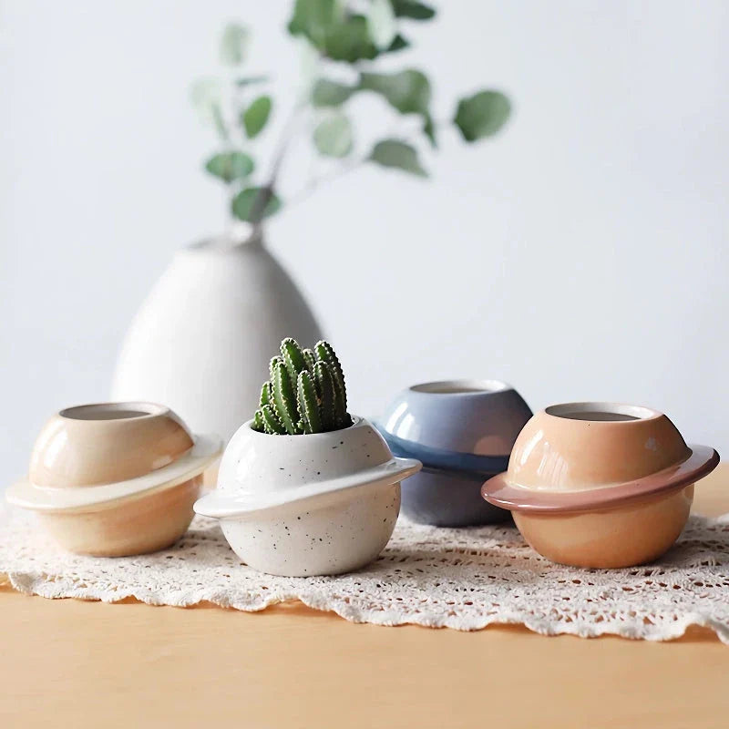 Mini Planet Shape Ceramic Succulent Flower Pot with a smooth, planet-inspired design in blue colour