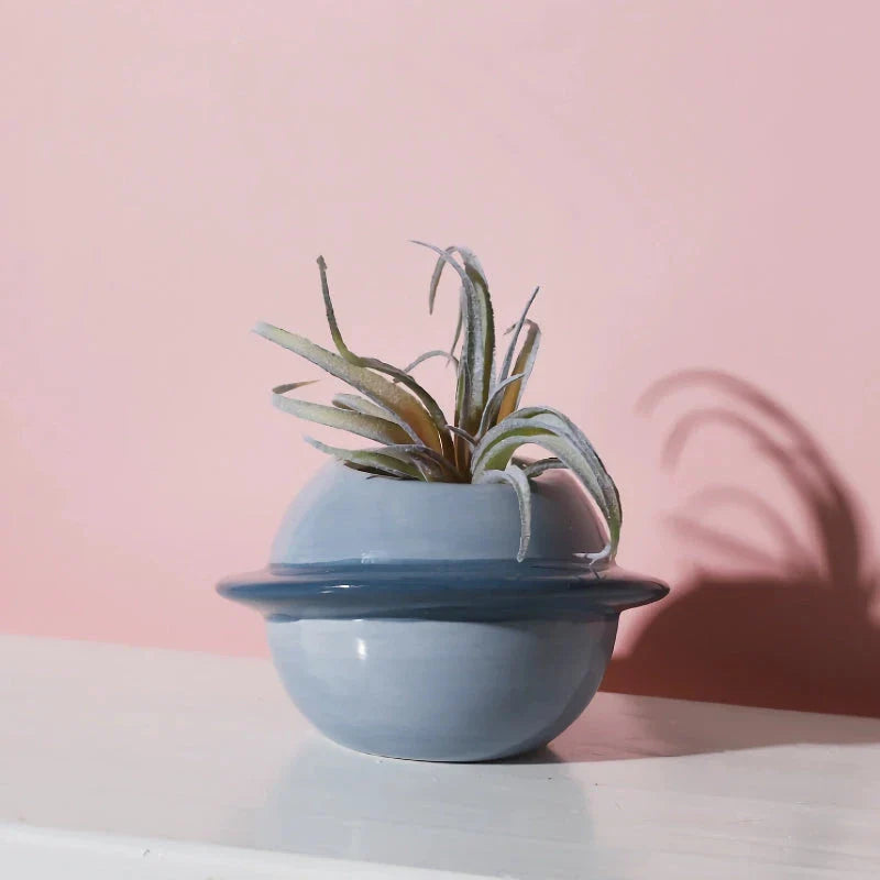 Mini Planet Shape Ceramic Succulent Flower Pot with a smooth, planet-inspired design in blue colour