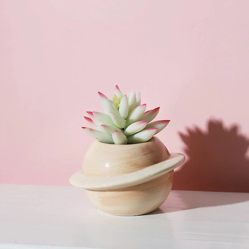 Mini Planet Shape Ceramic Succulent Flower Pot with a smooth, planet-inspired design in blue colour