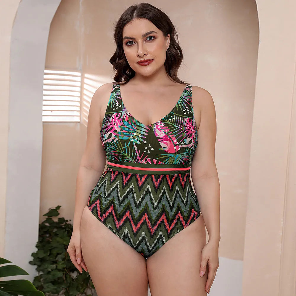 Blue and white printed women's one-piece swimsuit with spaghetti straps and a striped vest design.