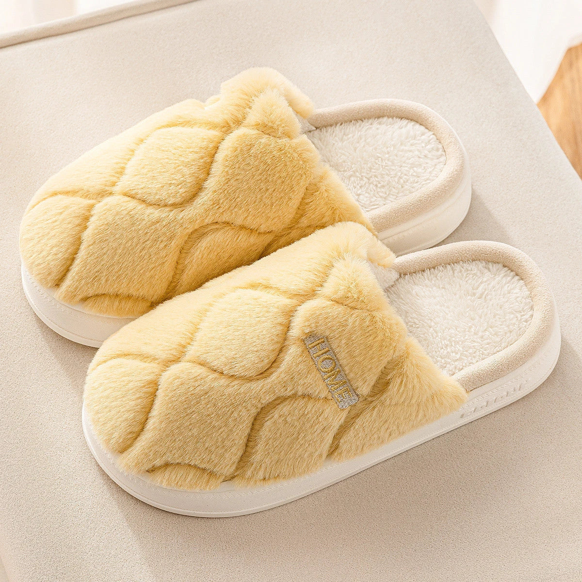 Cozy plush slippers with a soft, luxurious upper and durable PVC sole for comfortable indoor wear