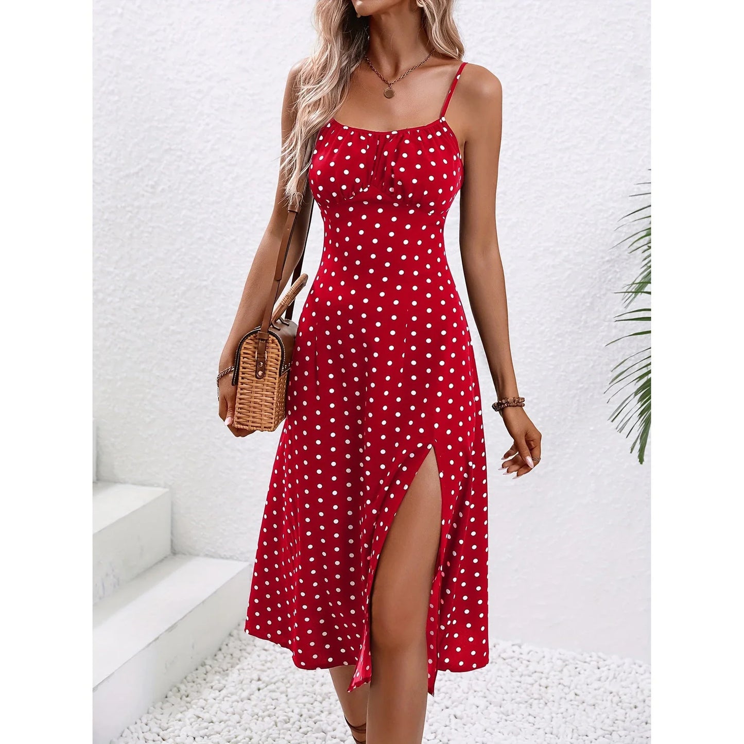 Elegant polka dot suspender dress with flattering side slit for women's summer fashion