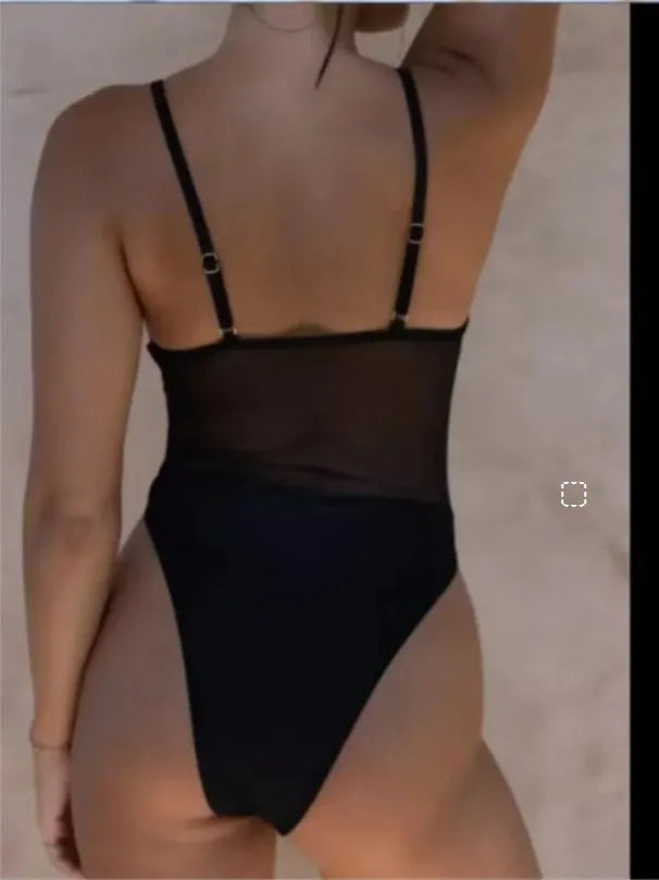 Black banded bikini one-piece swimsuit made of transparent polyester on a mannequin.