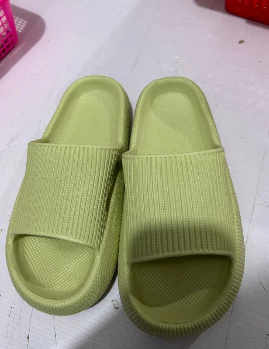Cozy slip-on slippers in various colors for men and women, featuring soft fabric upper and non-slip EVA soles