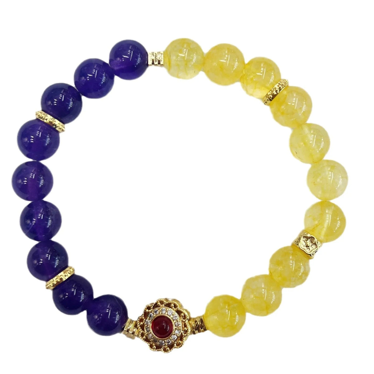 Handmade women's bracelet with yellow and purple amethyst crystals on wrist.