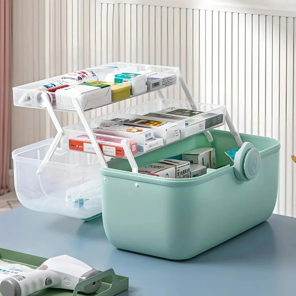 Large, white plastic medicine organizer box with multiple compartments for storing family medical supplies