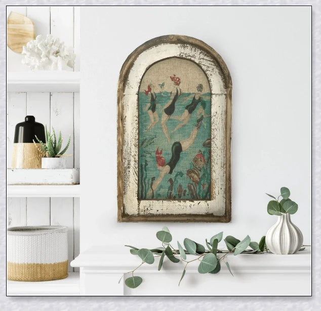 Decorative wall art featuring multiple swimmers and mermaids in a serene, aquatic-themed design