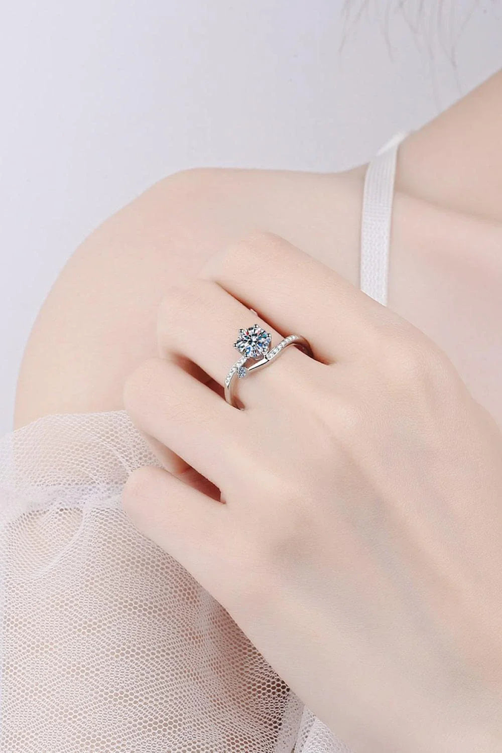 Elegant 925 sterling silver moissanite ring with sparkling centre stone and zircon accents