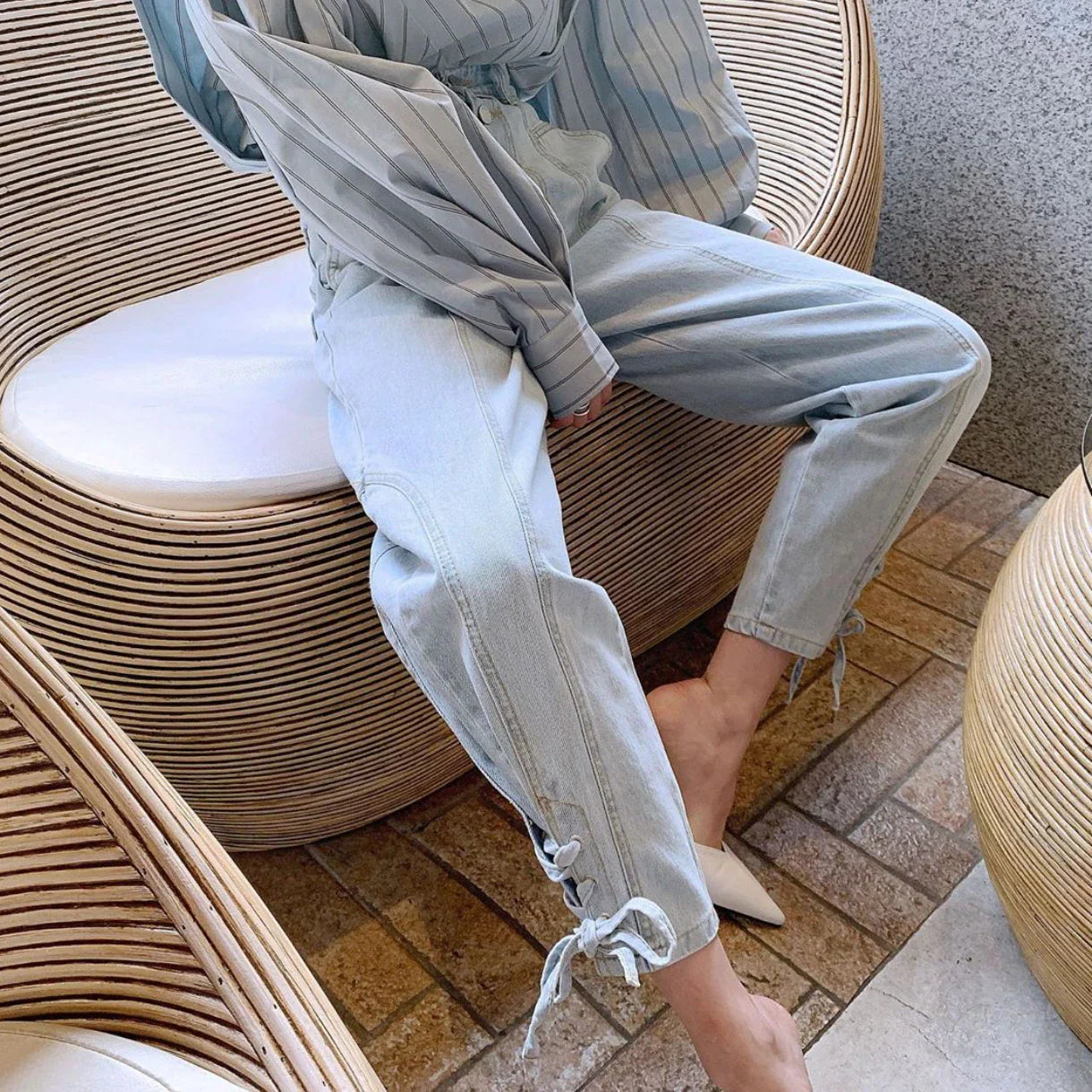 A pair of high-waist, loose, wide-leg jeans made from premium copper material for a stylish and comfortable look.