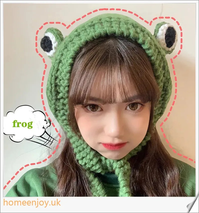 A cosy and stylish woollen hat featuring a charming cartoon frog design with big, expressive eyes