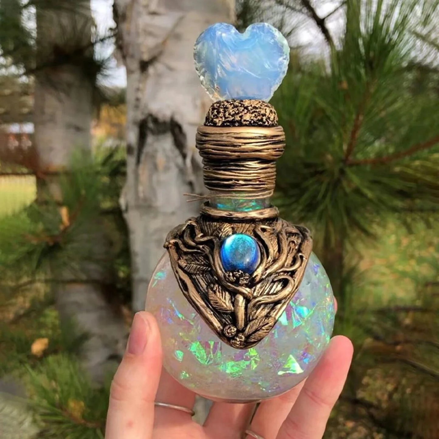 Shimmering resin ornament featuring a mesmerising mermaid design and glowing crescent moon