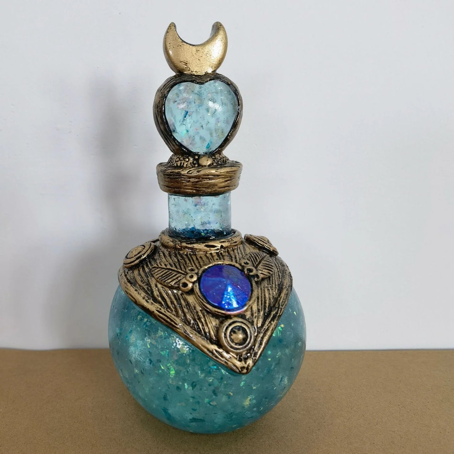 Shimmering resin ornament featuring a mesmerising mermaid design and glowing crescent moon