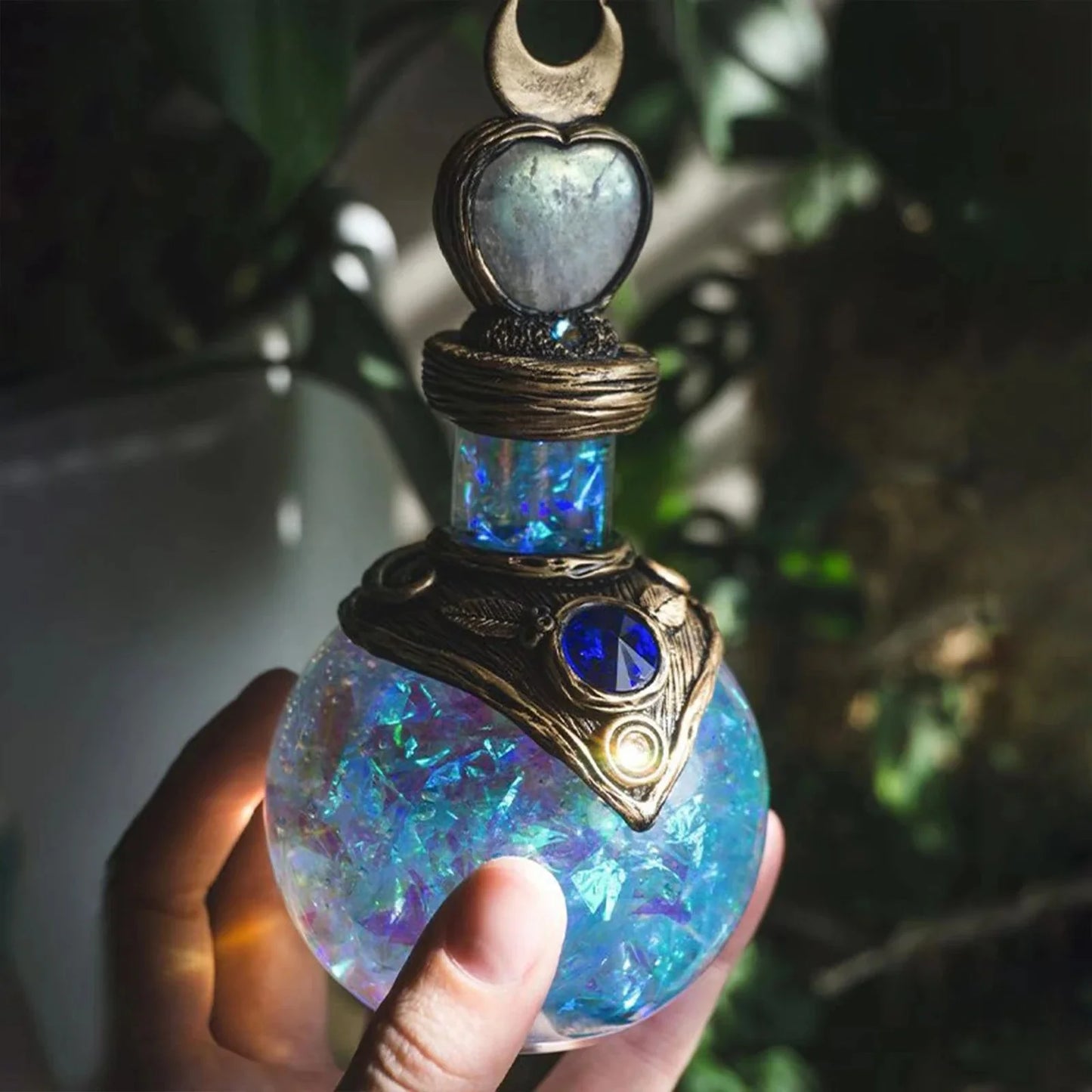 Shimmering resin ornament featuring a mesmerising mermaid design and glowing crescent moon