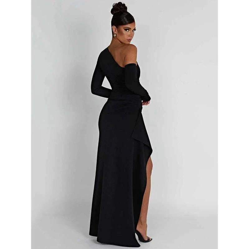 Elegant wine red maxi dress with oblique shoulder design, thigh-high split, and backless feature for sophisticated evening wear