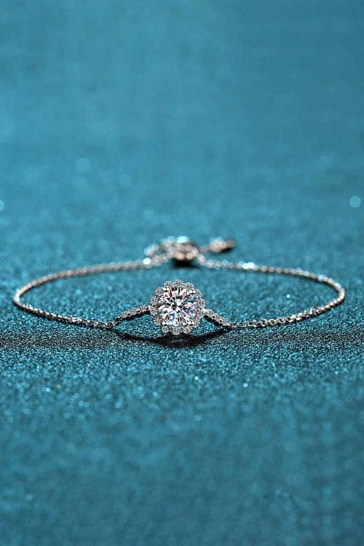 A close-up of a 1 carat moissanite chain bracelet made with 925 sterling silver and zircon accent stones.