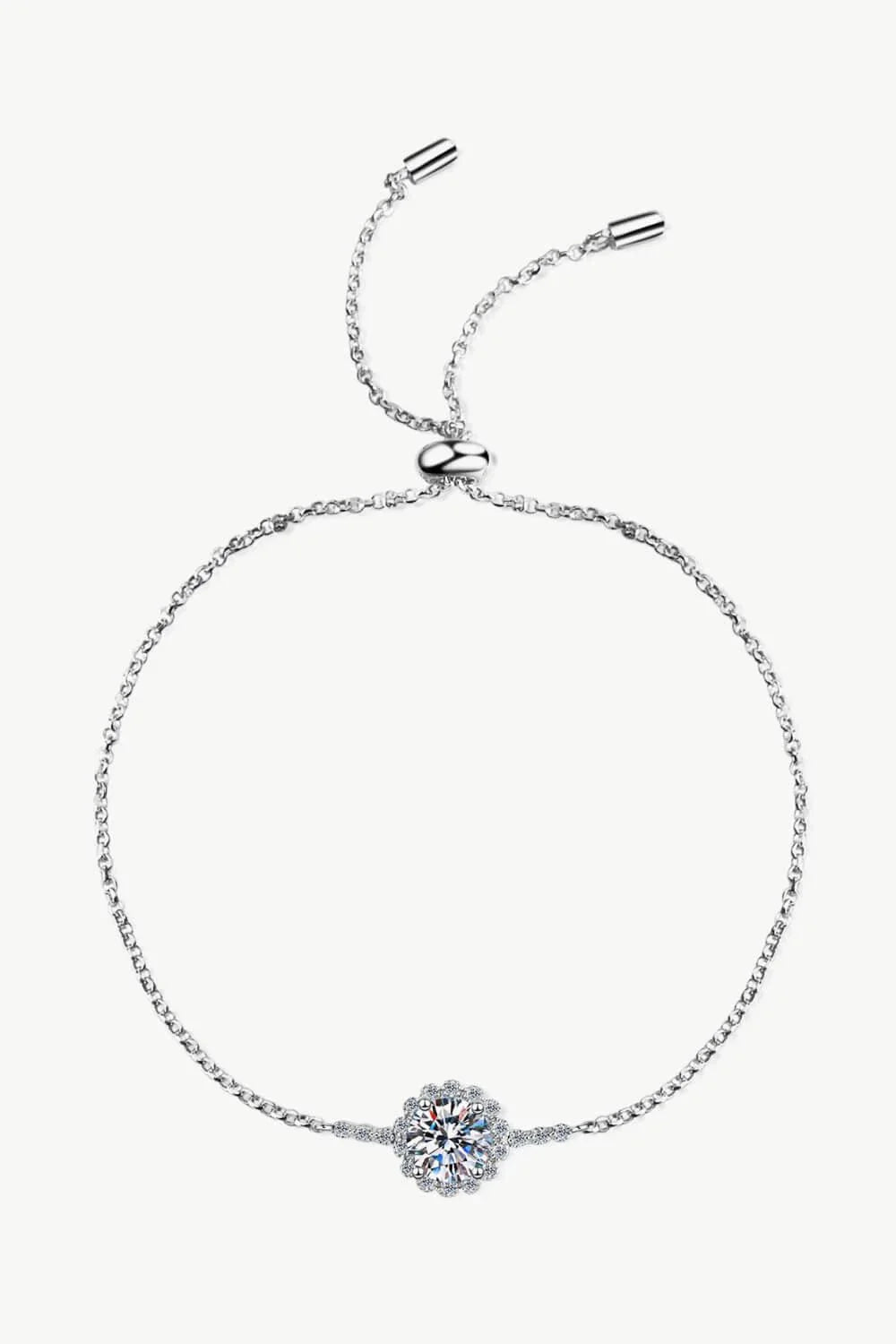 A close-up of a 1 carat moissanite chain bracelet made with 925 sterling silver and zircon accent stones.