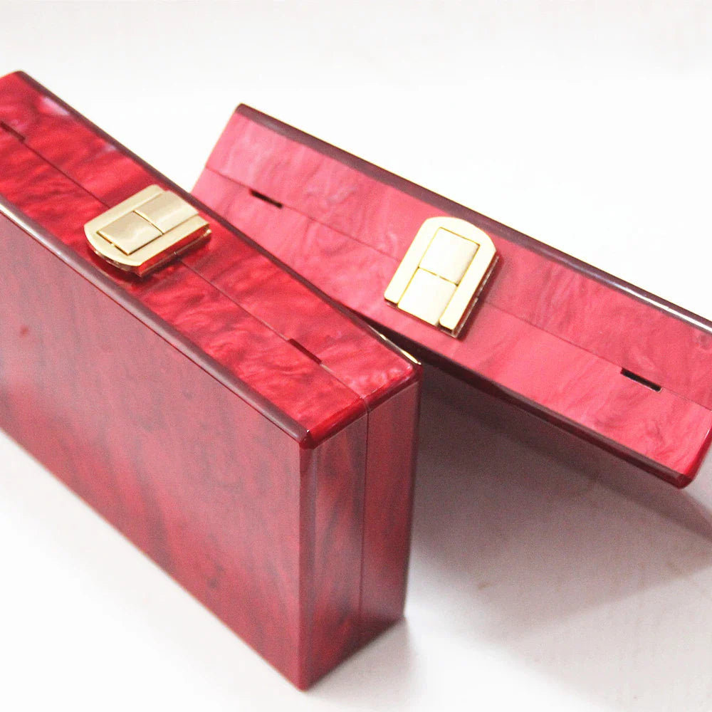 Pearlescent acrylic one-shoulder messenger bag in a stylish red colour, perfect for formal events and everyday use.