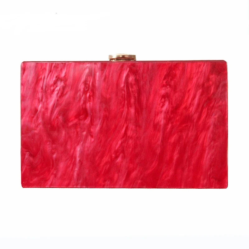Pearlescent acrylic one-shoulder messenger bag in a stylish red colour, perfect for formal events and everyday use.