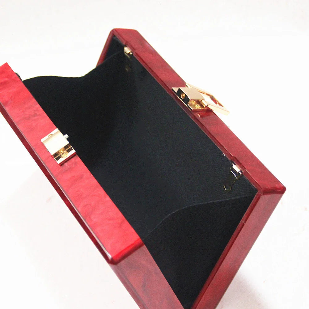 Pearlescent acrylic one-shoulder messenger bag in a stylish red colour, perfect for formal events and everyday use.
