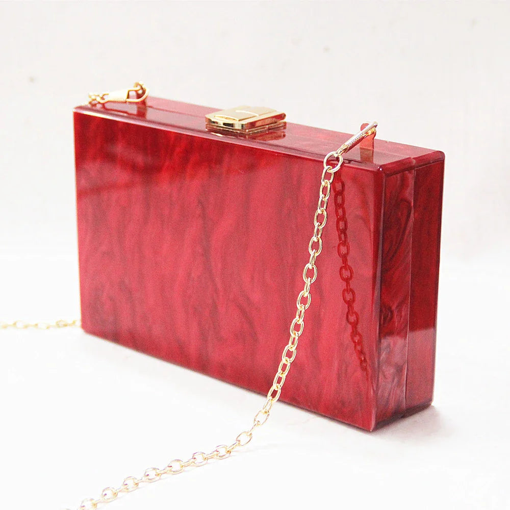 Pearlescent acrylic one-shoulder messenger bag in a stylish red colour, perfect for formal events and everyday use.