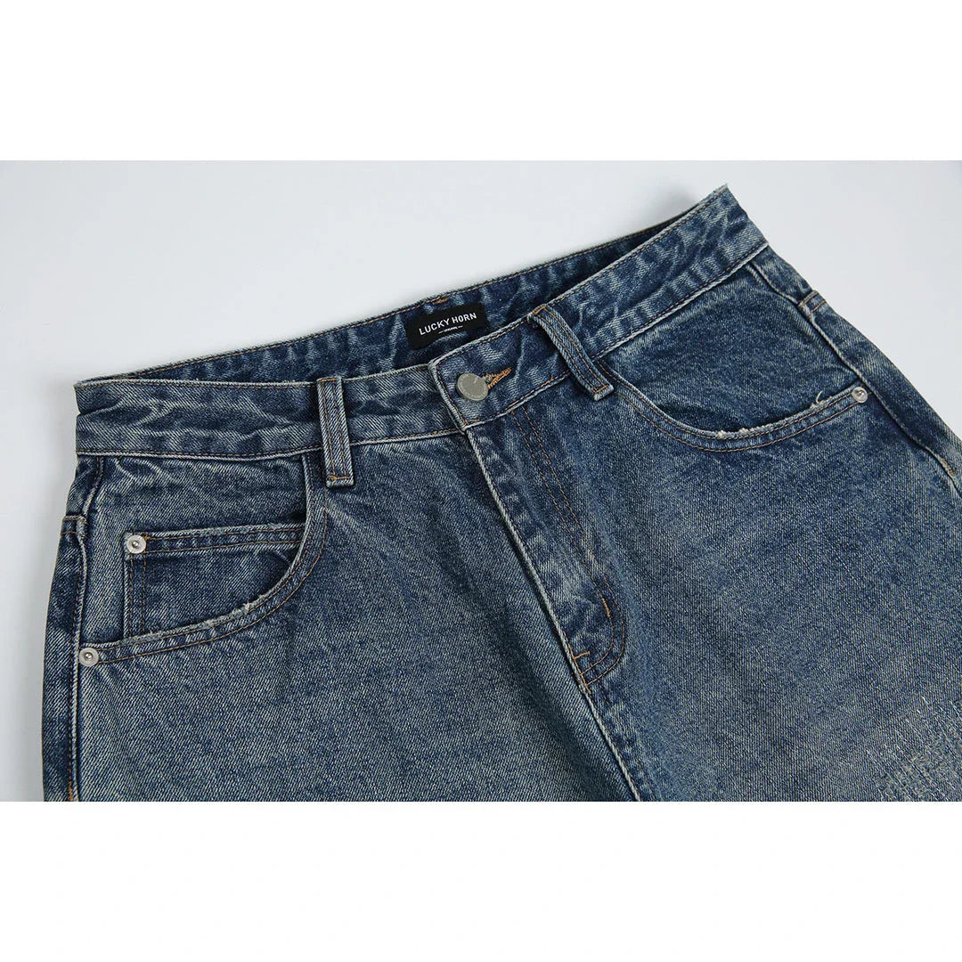 Autumn New Retro Loose Jeans in dark blue, featuring a tapered leg design and unique printing techniques for a vintage-inspired look.