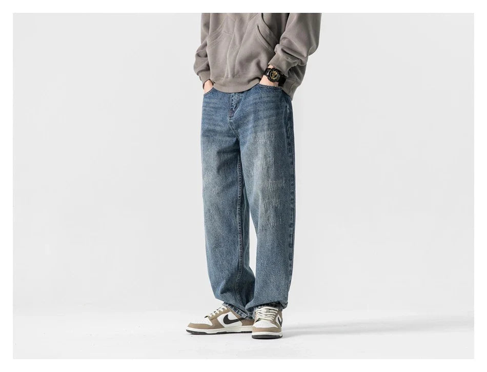 Autumn New Retro Loose Jeans in dark blue, featuring a tapered leg design and unique printing techniques for a vintage-inspired look.