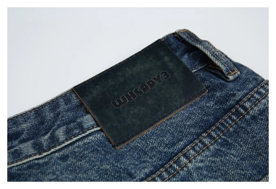 Autumn New Retro Loose Jeans in dark blue, featuring a tapered leg design and unique printing techniques for a vintage-inspired look.