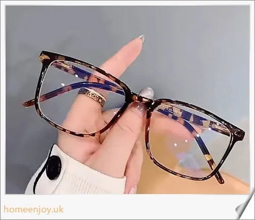 Bluelight reduction glasses with various frame colours including matte black, transparent, and leopard print